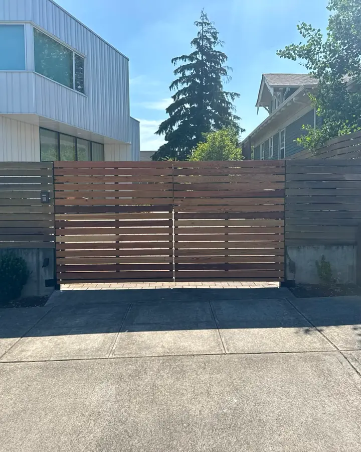 Modern horizontal cedar slat driveway gate with keypad, finished — Interstate Gate Repair